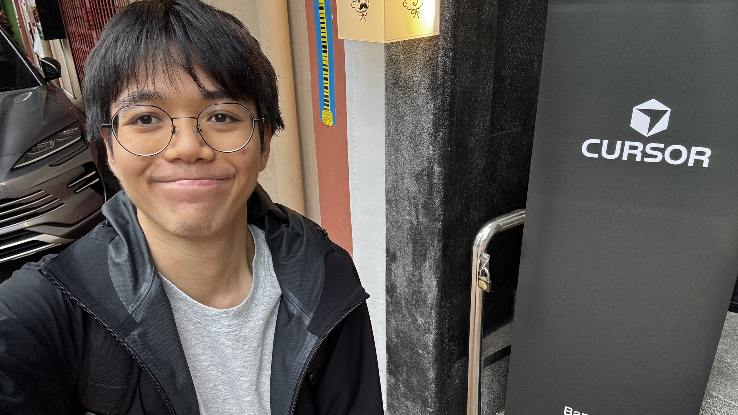 Portrait of Nakarin Phoorahong wearing glasses
